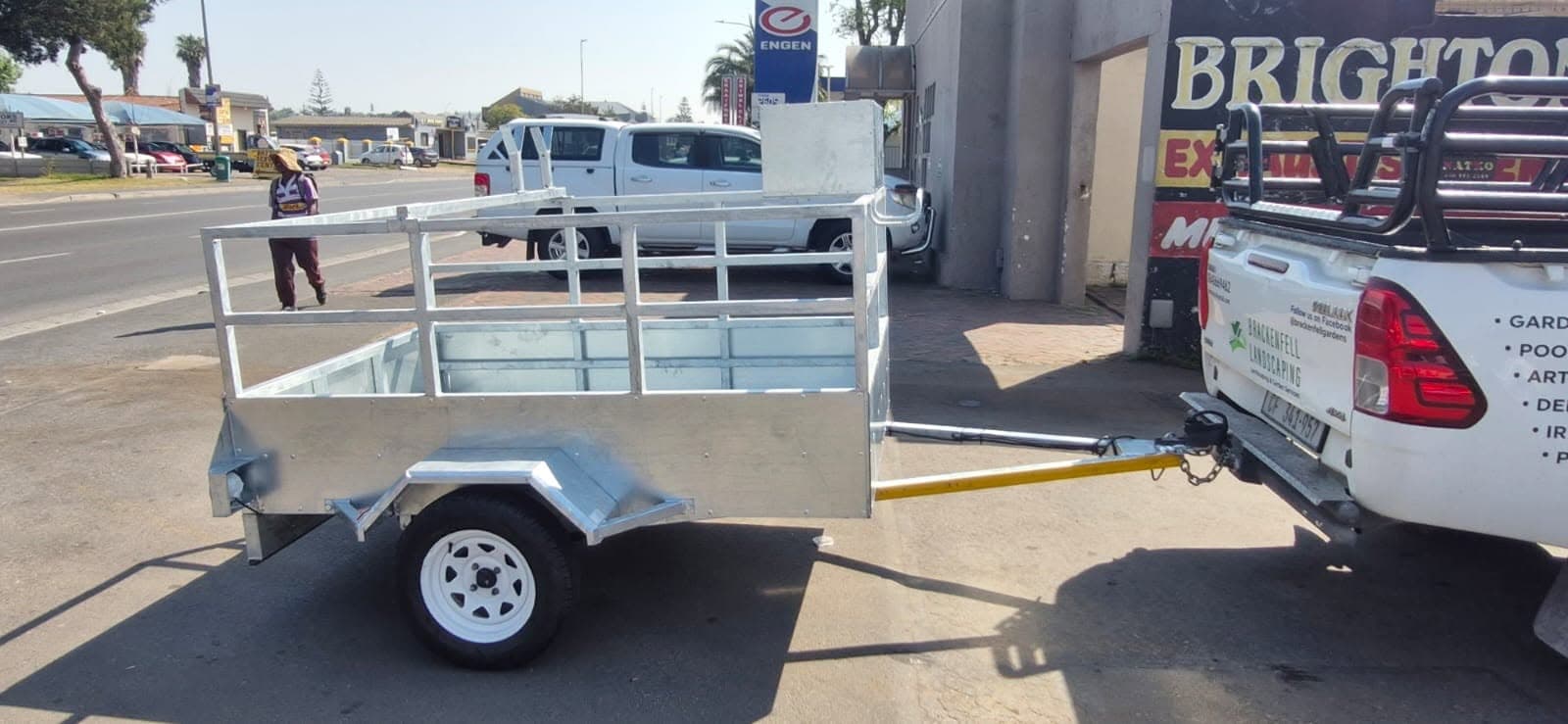Side view of the rebuilt galvanised trailer with refurbished white wheels